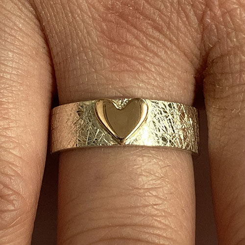 White gold band with yellow heart