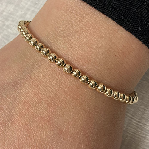 Yellow gold bracelet with T bar