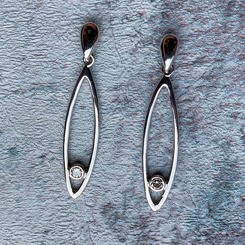 white gold drop earrings with round brilliant diamonds