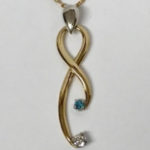 White gold handmade pendant with topaz