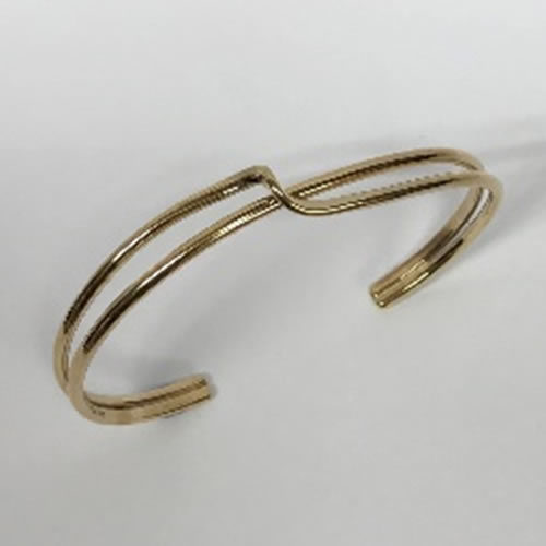 yellow gold torque style bangle