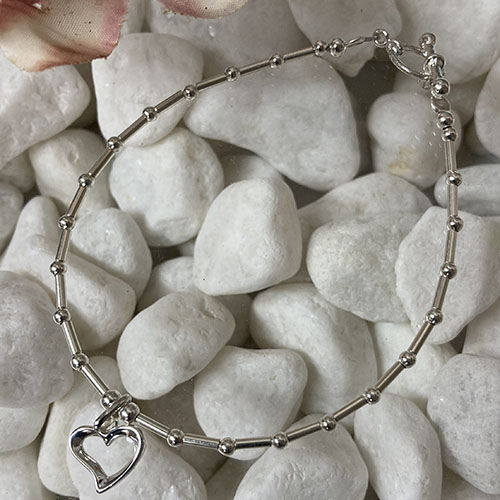 Sterling silver tube and bead bracelet with open heart charm