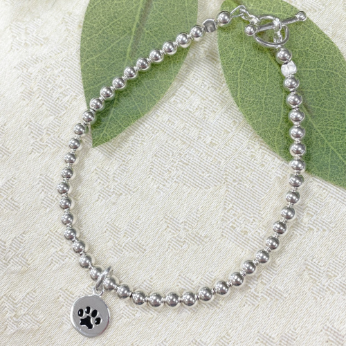 Silver bracelet with paw charm