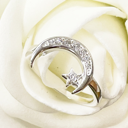 Silver crescent moon and star ring