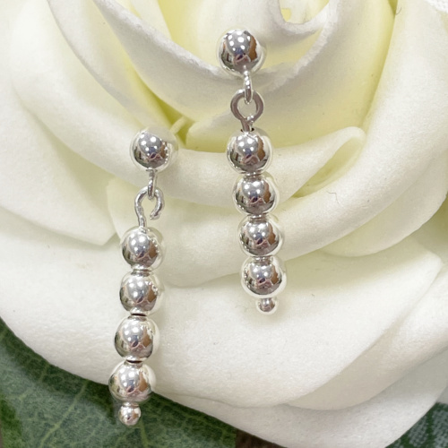 Silver four ball drop earrings