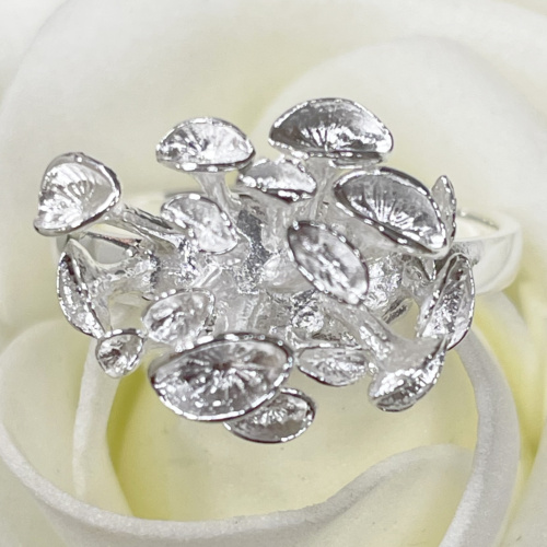 Silver ring with abstract leaf shapes