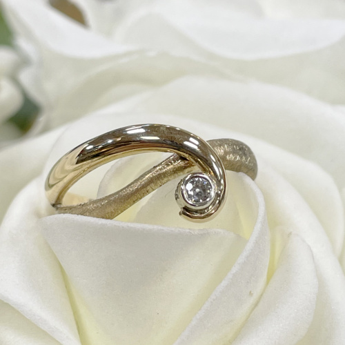 Yellow gold and diamond twist ring