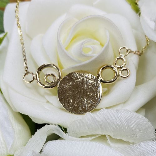 Yellow Gold Pendant with hammered finished center.