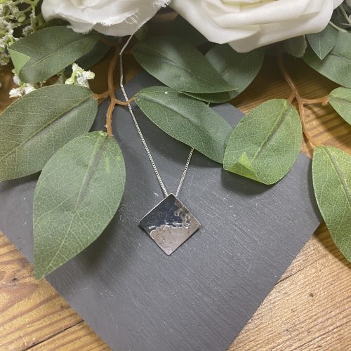 Silver diamond shaped hammered pendant