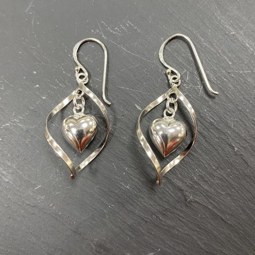 Silver open oval drop earrings with a silver heart